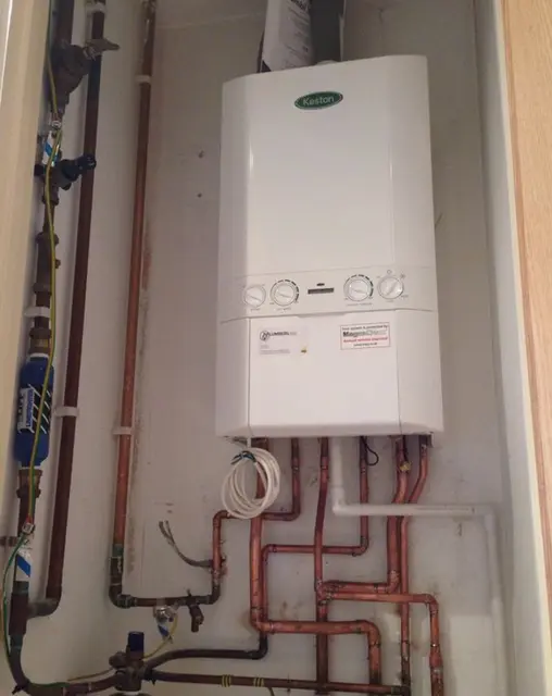 Gas boiler replacement with clean copper pipework, isolation valves and filling loop installed by Gas Safe engineers.